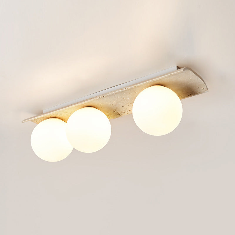 Serenaya kulista lampa sufitowa ze szkła i travertinu