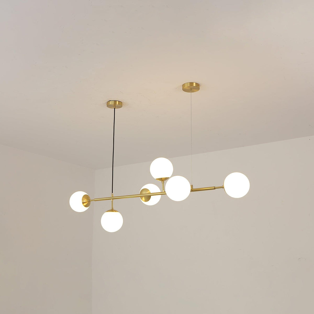 Valentina Industrial długoliniowa metalowa wisząca kula wielopunktowa z przezroczystą żarówką do sypialni lampa wisząca mosiądz/czarny