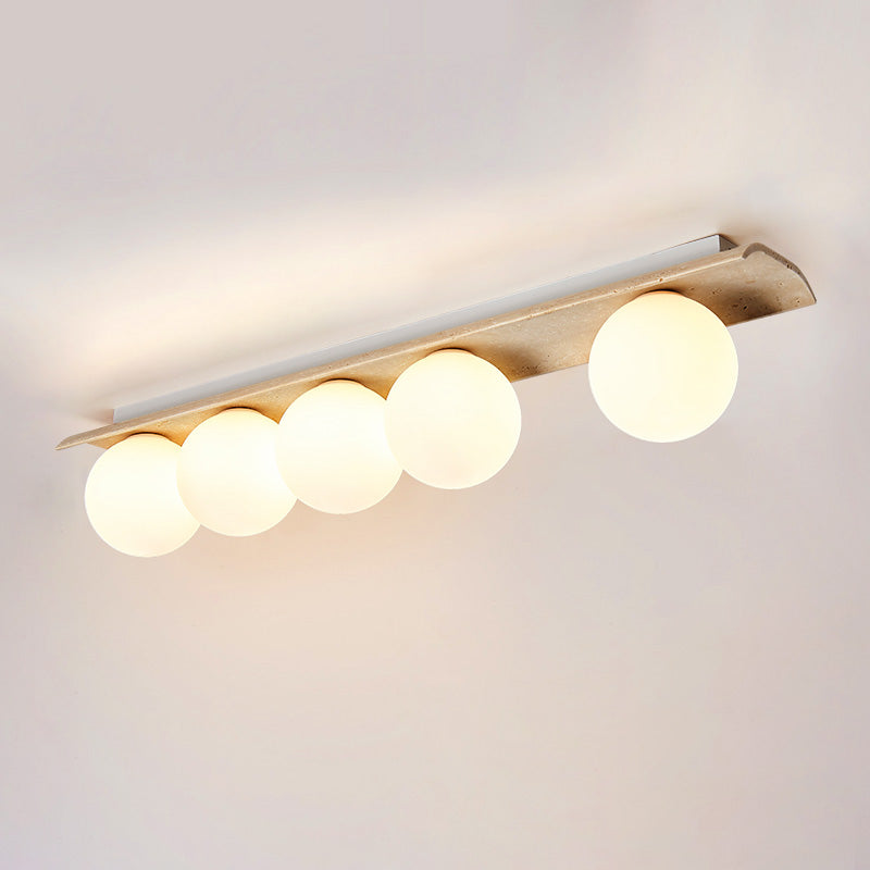 Serenaya kulista lampa sufitowa ze szkła i travertinu