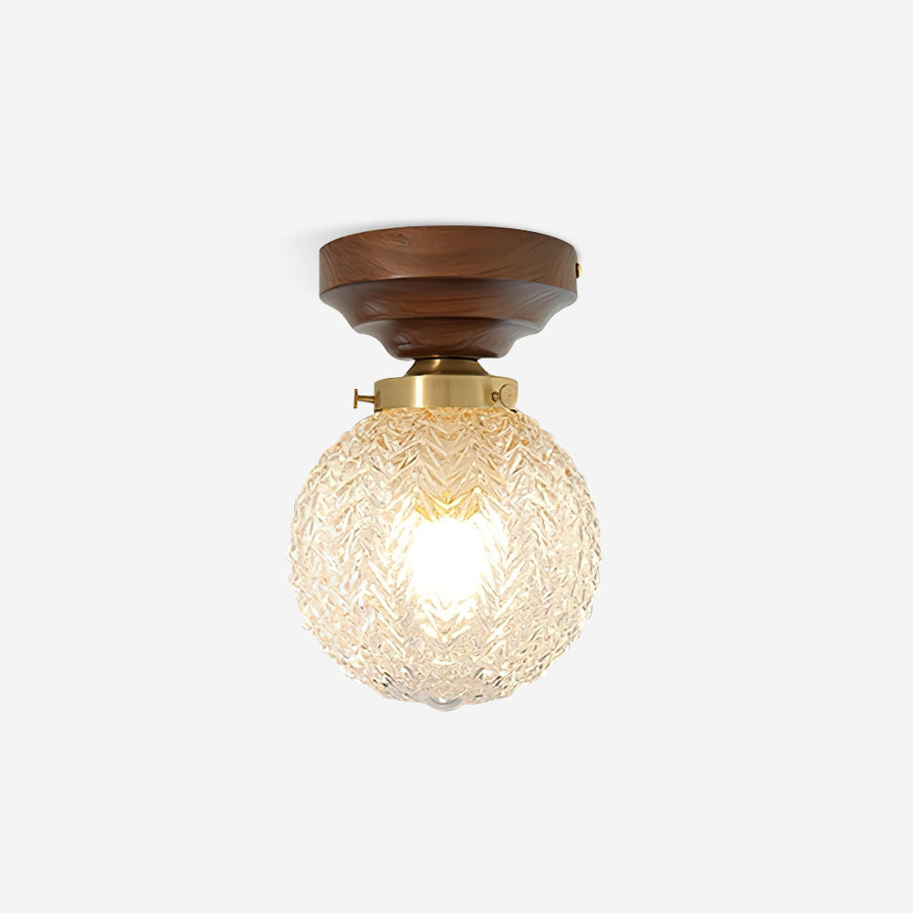 Lampa sufitowa kulista ze szkła przezroczystego, drewna orzechowego i rozetą miedzianą