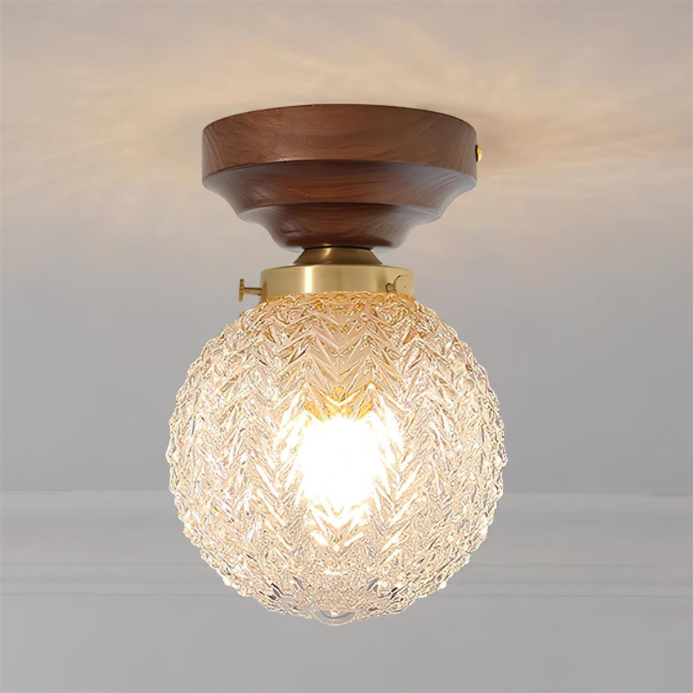 Lampa sufitowa kulista ze szkła przezroczystego, drewna orzechowego i rozetą miedzianą