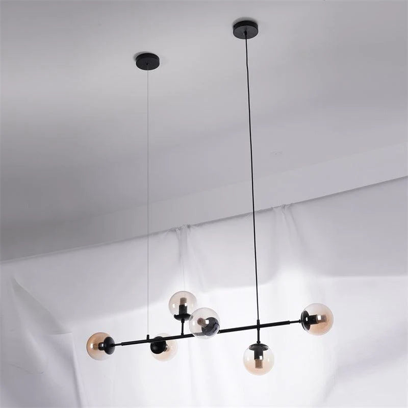 Valentina Industrial długoliniowa metalowa wisząca kula wielopunktowa z przezroczystą żarówką do sypialni lampa wisząca mosiądz/czarny